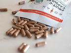 KOYAH Fruit-C organic vitamin C capsules spilling from resealable pouch